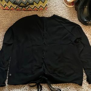 Lululemon black sweater with lace up back. Sz 10. Good condition